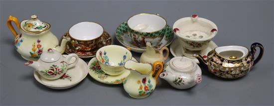 A collection of miniature teawares, including Royal Crown Derby, Worcester, Crown Staffordshire